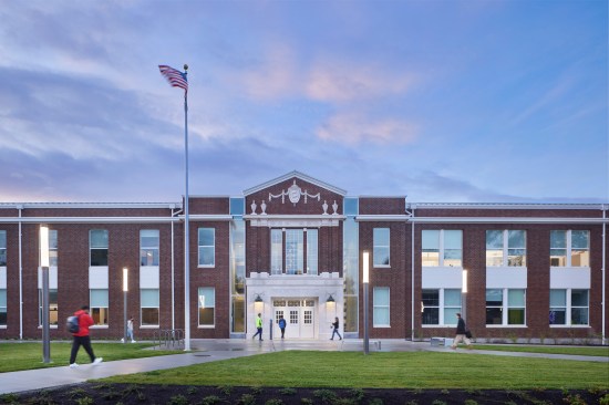 The replacement school retains the look of the original building. Terra cotta was salvaged from the original school and used for the new entry.