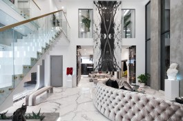 Bookmatched marble over the fireplace.