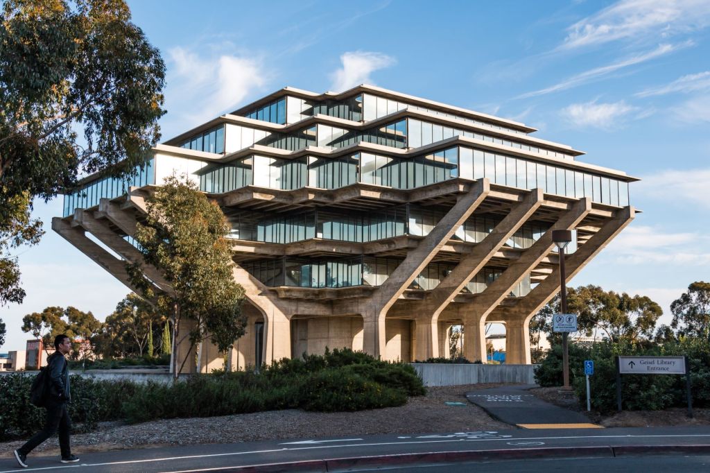The textured and patterned site-cast tilt-up concrete walls of the East Campus Office Building at the University of California San Diego appear almost as an extension of the canyon geology. Tilt-up construction allowed campus workers to move into the building less than a year after construction began.