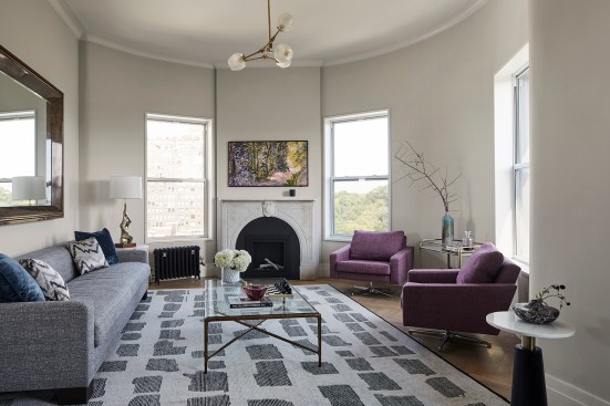 Living room with relocated fireplace and restored plaster ceiling trims