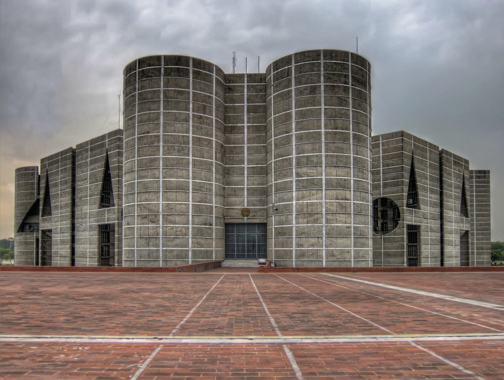 Jatiya Sangsad Bhaban or National Parliament House, is the house of the Parliament of Bangladesh, located at Sher-e-Bangla Nagar in the Bangladeshi capital of Dhaka. Designed by architect Louis Kahn, the complex is the largest legislative complexes in the world, comprising 200 acres.