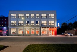 The bold red of the recessed entrance continues along an inside wall to help orient patrons who are partially-sighted.