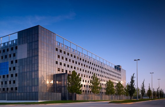 The east elevation along Shartel Ave. holds the entire city block together.  The polycarbonate panels change color from sunrise to noon.  