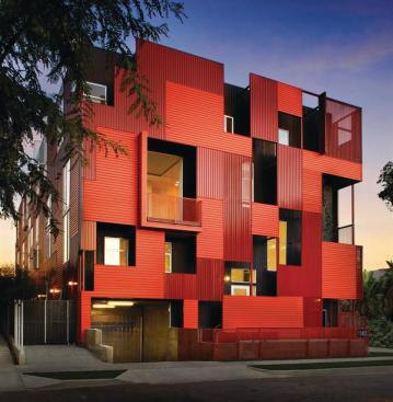 Formosa 1140s vibrant red metal facade, says architect Lorcan O Herlihy, was "a readily available and cost-effective solution" to the challenge of finding a suitable exterior material.