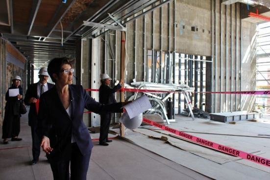 Elizabeth Diller walks journalists through the second floor of the “vault” -- past a space that will be used as a public lecture room.
