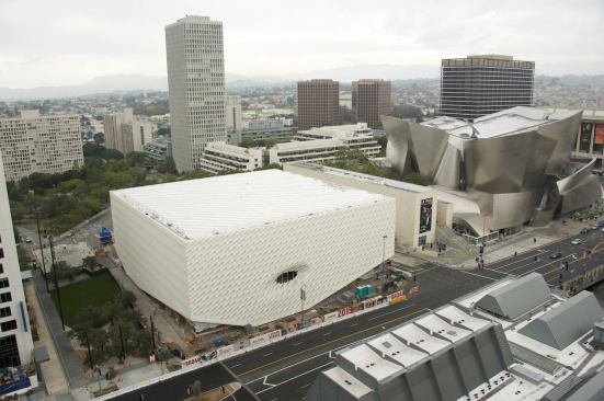 The Broad is in solid architectural company in downtown Los Angeles: It is adjacent to the Walt Disney Concert Hall, by Frank O. Gehry Architects, and across the street from the Colburn School, which features the architecture of Hardy Holzman Pfeiffer Associates, Lloyd Wright, and Pfeiffer Partners Architects (the Grand Avenue location of MoCA, by Arata Isozaki & Associates is next door to the Colburn School, and not pictured).