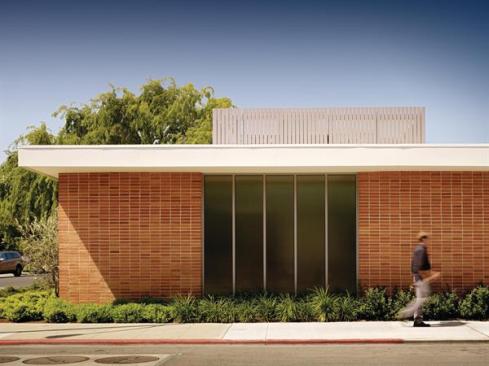 The bones of the original structure were kept and spruced up, while a roof screen masks mechanical systems and 24 photovoltaic panels.