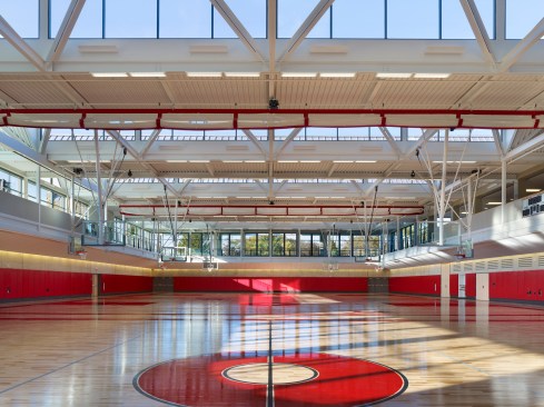 The field house floor is depressed 15 feet below grade to take advantage of the earth's cooling effects.