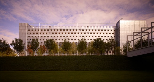 The west elevation from CHK 14 connects to Car Park 3 with the white square grid and polycarbonate openings.  The CHK 14 entry bridge is on the right.  