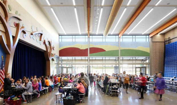 Multipurpose room with cafeteria seating.