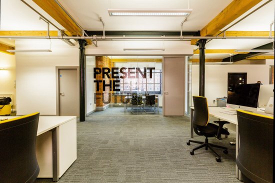 Interior shot of branded glass partitioning for Buffalo 7, Manchester, UK