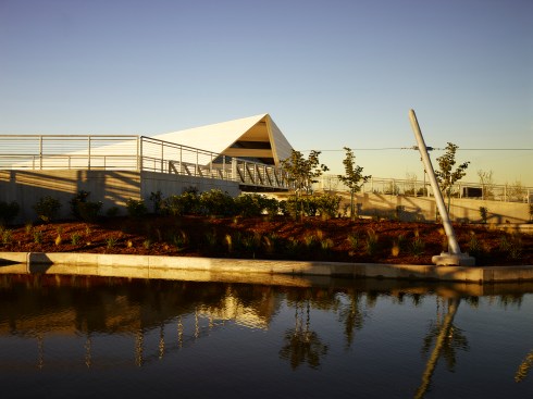 The white water Main Building anchors the development