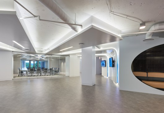 Ford Motor Company’s Government Affairs 18,000 SF space is designed to support the company’s core business objectives, welcome community partners, and use subtle automotive design details to reflect the company’s history, future, and brand pillars of electrification, autonomy and mobility. The “Innovation Space” introduces Ford and Lincoln’s branding, nostalgia and drive towards the future. Gestures like the bronze-framed storefront glass system and wall graphics evoke the roots of the automotive industry.