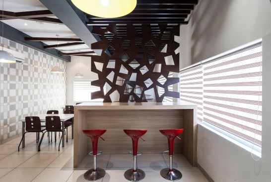 Striped blinds let in soft, muted light illuminating the café interiors