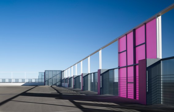 The raised parapet panels provide wind protection on the roof level.  