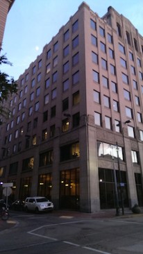 1920s wood-framed hung windows were replaced in the 1980s with fixed windows that did not reflect the building's historic character