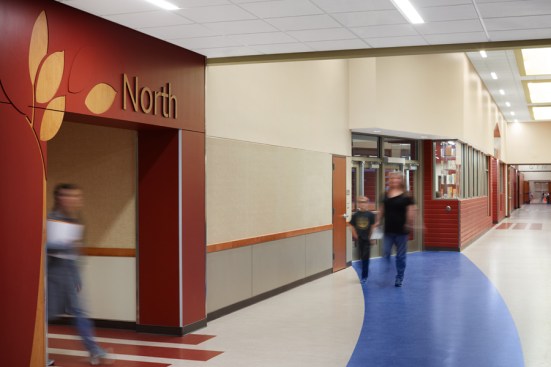 Hallway featuring directional elements..