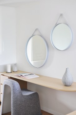 Tranquillity and retreat are sought with a fresh material palette of wood and fabric.