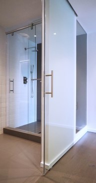 Master shower with all glass wall and view to the outdoors