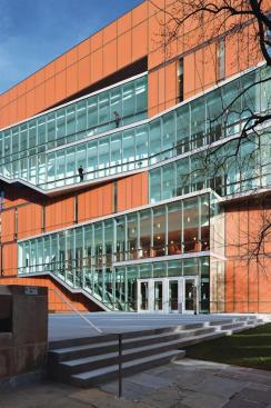 On the west side of the building, the projecting fire stair is clad in clear vision glass through which student activity can be seen, creating a dynamic fa?ade. Certain spaces?like the open area in front of the buildings elevator, seen here above the entry doors?have been claimed by students as informal study lounges. Furniture was brought in to accommodate them. "The students are in the building 24 hours," Spar says, "and they've made it their own." At the time of the building's soft opening in fall 2009, much of the break out furniture had intentionally not been ordered. Since most of it was designed by Weiss/Manfredi, the goal was to see how the pieces were used in different spaces, so that the fabrication of the pieces could meet specific needs.