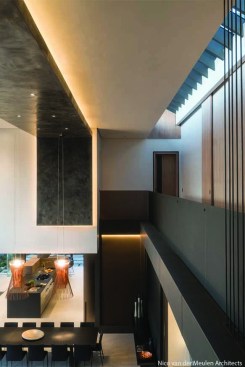 Skylit walkway linking main bedroom and guest bedrooms