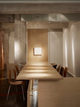 The+Gallery+seats+a+maximum+of+10+surrounding+a+Baltic+Birch+slab+table.++The+west+end+of+the+table+is+the+focal+point+art+for+discussion.+Notice+the+random+seating%2c+the+hors+d%e2%80%99oeuvre+table+made+from+used+wood+pallets%2c+and+the+exposed+exterior+masonry+wall.