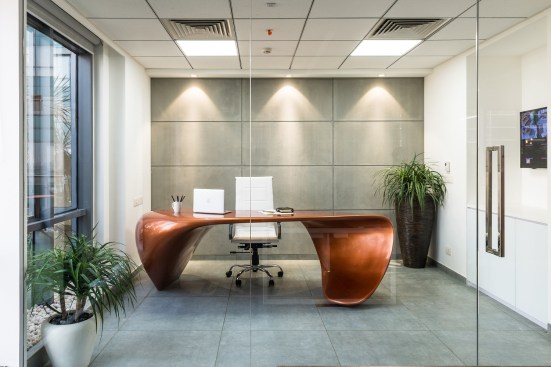 Getting the fluid table manufactured wasn't as smooth as its curves and was made to order by a local artist and not a furniture vendor.
