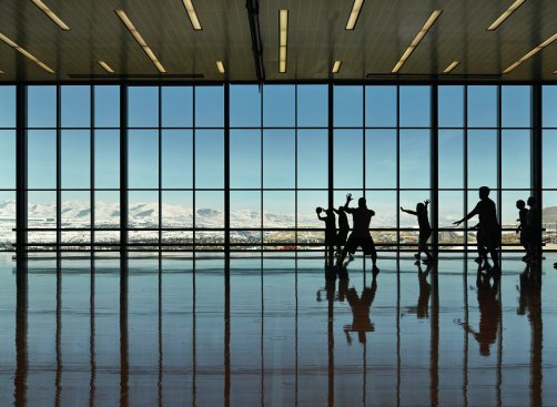 High-performance glazing allows views to surrounding mountain ranges while contributing toward LEED Gold certification.