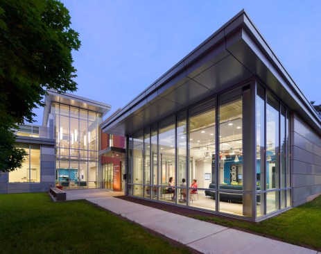 Located on Perkins' main entry drive, massing and materials relate to the established campus fabric, while referencing the new contemporary functions within.