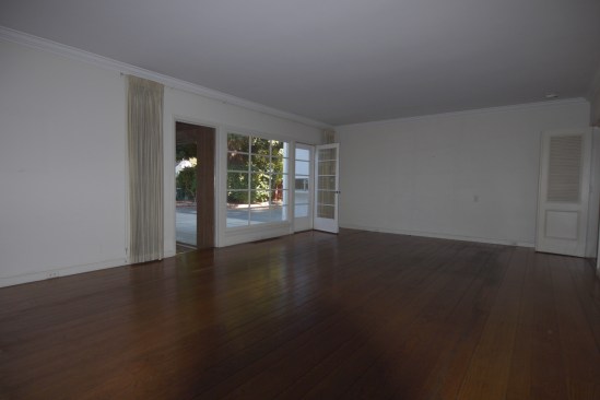 Before- Interior view looking from Living Room towards backyard and Kitchen