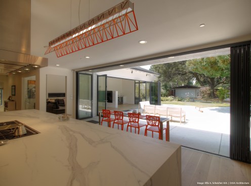 After- View from Kitchen to Family Room and yard (doors open)