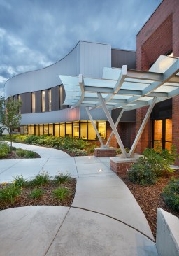 Exterior entry. Bold metal jutting out from the main building conveys the client's solid, yet bold business model.