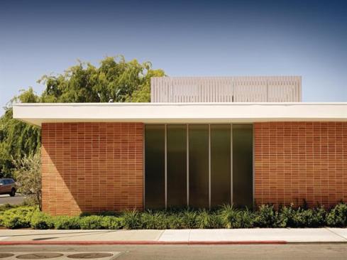 The bones of the original structure were kept and spruced up, while a roof screen masks mechanical systems and 24 photovoltaic panels.