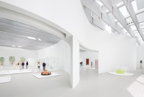 Daylit galleries enclosed by curved concrete walls