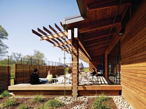 Outdoor space is a critical element of the building program. Patios like this one off of the employee dining room provide permanent outdoor seating, while benches and pathways encourage visitors and staff members to engage with the surrounding landscape.