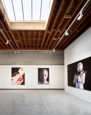 Existing board formed walls and wood ceiling are highlighted throughout.