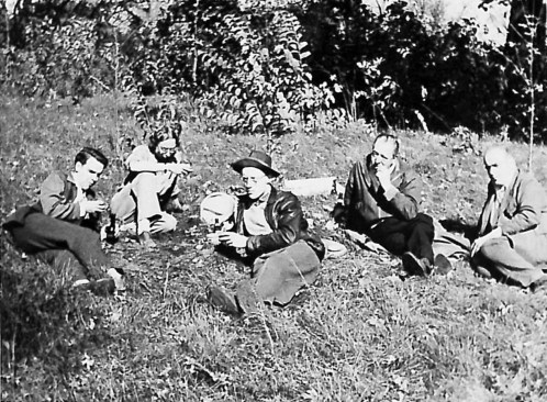Farnsworth, Mies, and others picnicking on the site during construction