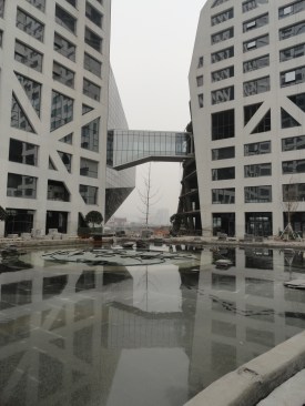 A pond takes shape beneath some of the towers.