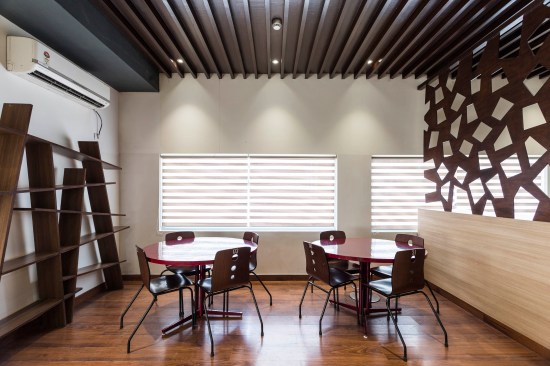 False ceiling and flooring are used to distinguish areas within the café .