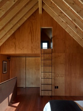 Second-floor bedroom with ladder to loft