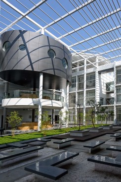 Shaded Courtyard: The building with the courtyard is a traditional & effective configuration for cooling in hot-dry climate, where there is a large diurnal temperature swing. Here, it forms the focal point in the entire building  & also acts a waiting lobby  for  visitors. 
