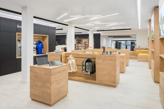 merchandise presentation is separated into zones through lighting concept