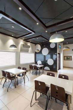 The ceiling is dark grey to contrast with the lighter floor and walls.The ceiling is dark grey to contrast with the lighter floor and walls.