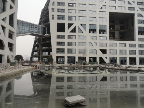 Two towers connect via a bridge.