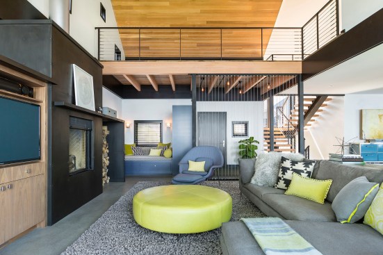 Modern living room with loft space above