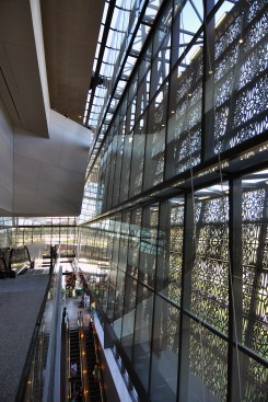 Vertical circulation wraps central gallery spaces on the upper levels. 