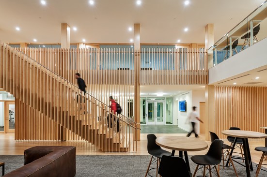 The hospitality industry–inspired common areas use warm wood tones and furniture from Article.