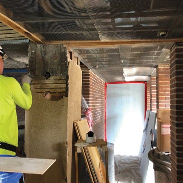The plaster restoration process started by removing non-original or compromised plaster and exposing the original laths. 