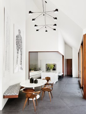 A small dining nook off the family room leads to the kitchen, outfitted with Kallista fixtures.