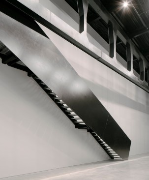 Metal stair from machine showroom to third-floor skywalk